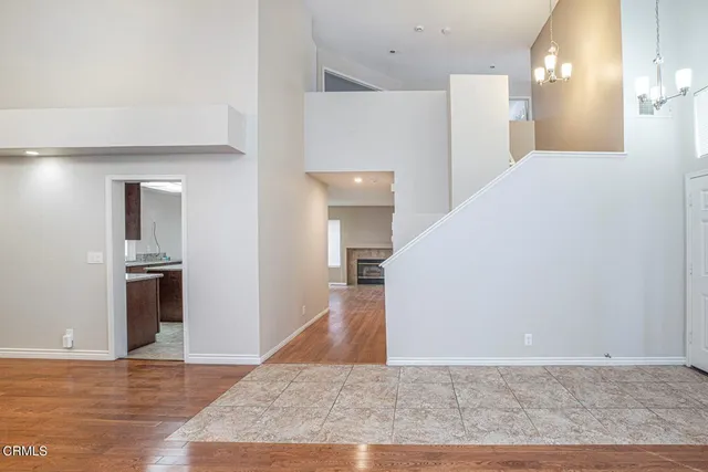 a view of a kitchen with wooden floor