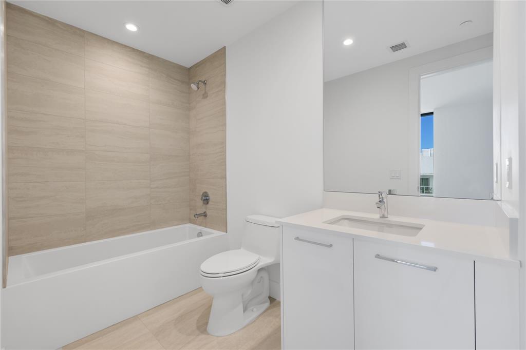 151 North Seabreeze Boulevard, Unit 903E Fort Lauderdale, FL 33304 - Photo 23 of 49 a bathroom with a sink a toilet and shower