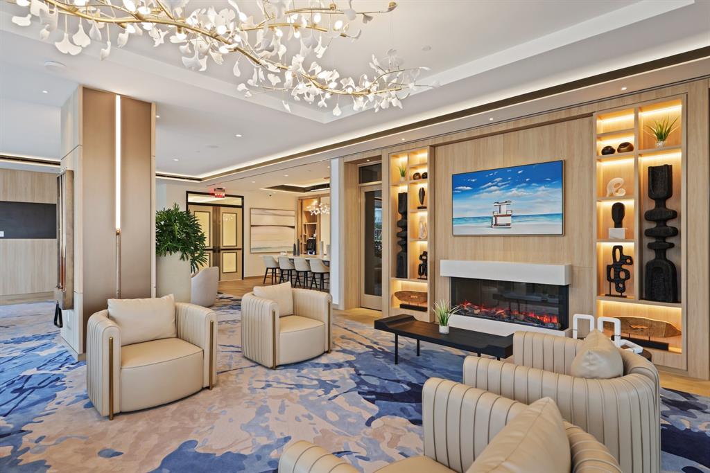 151 North Seabreeze Boulevard, Unit 903E Fort Lauderdale, FL 33304 - Photo 32 of 49 a living room with furniture fireplace and a large window