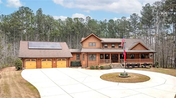 an aerial view of residential house with outdoor space