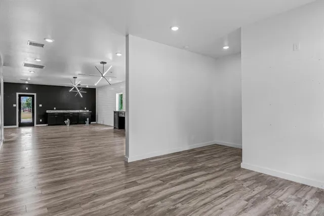 a view of kitchen with furniture and wooden floor