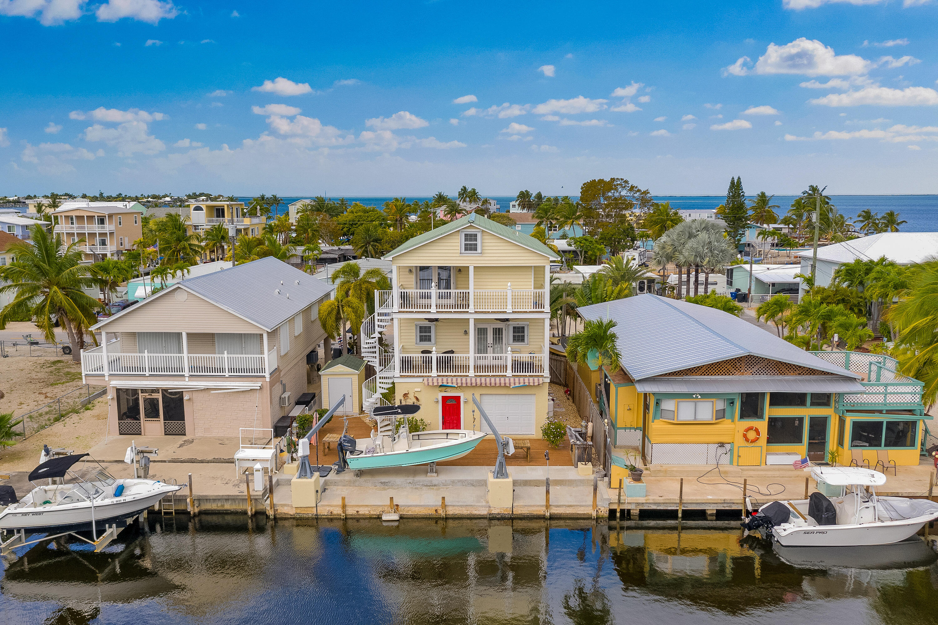 a front view of houses with yard