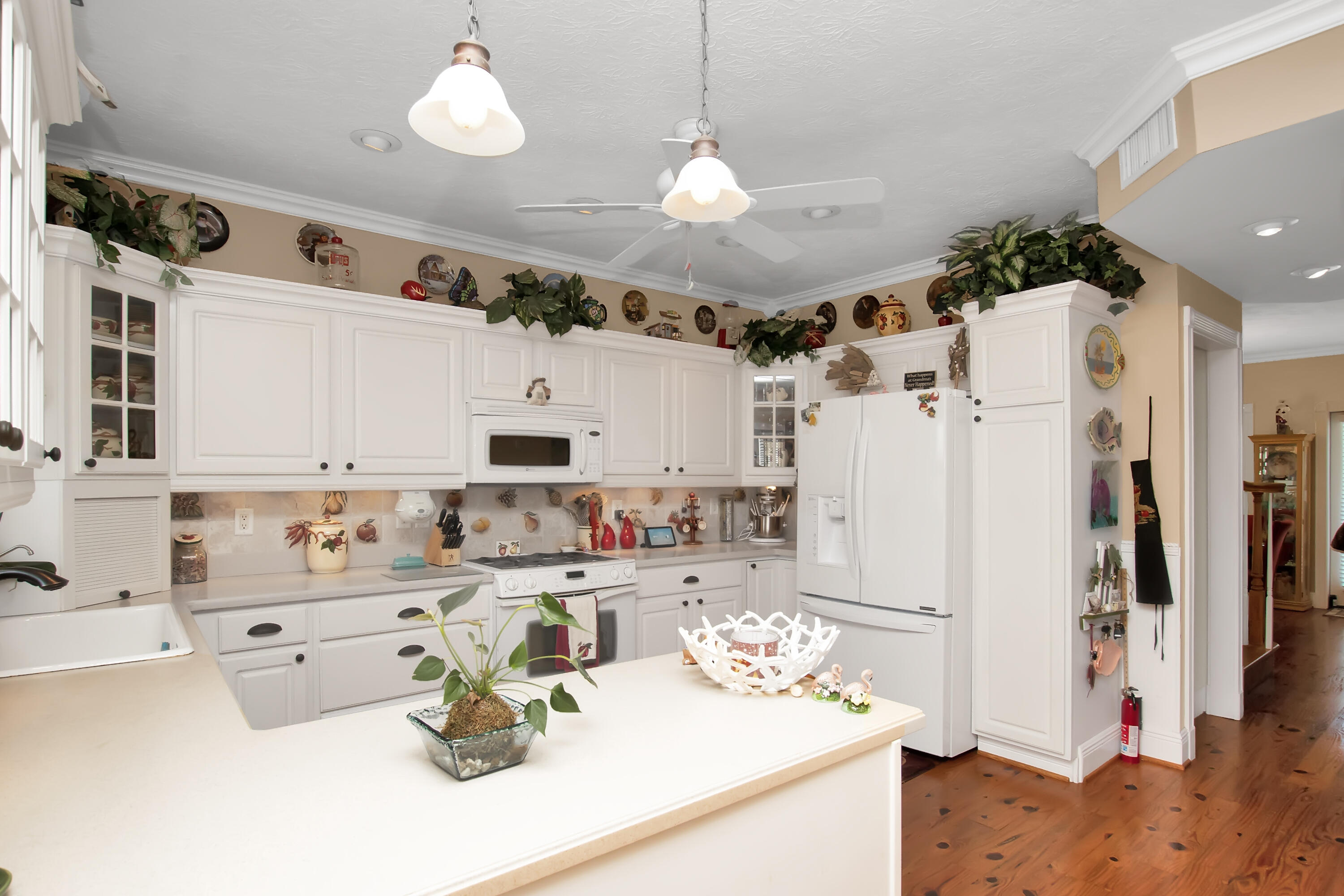 13 Flamingo Road Key Largo, FL 33037 - Photo 23 of 63 a kitchen with stainless steel appliances kitchen island granite countertop a refrigerator and a sink