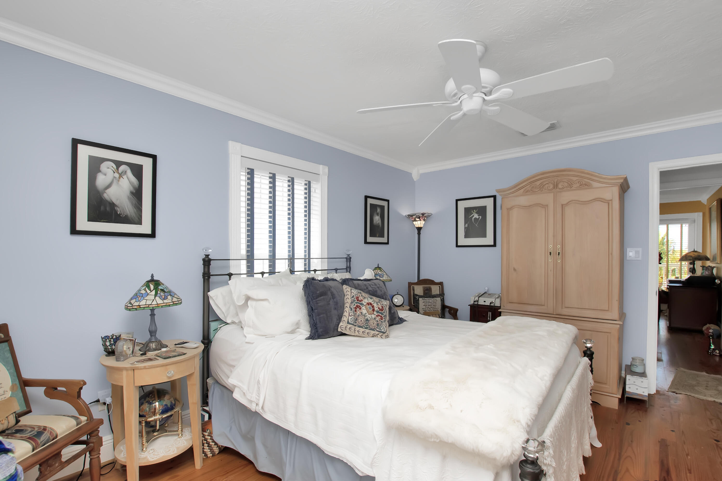 13 Flamingo Road Key Largo, FL 33037 - Photo 34 of 63 a bedroom with a bed and a chandelier