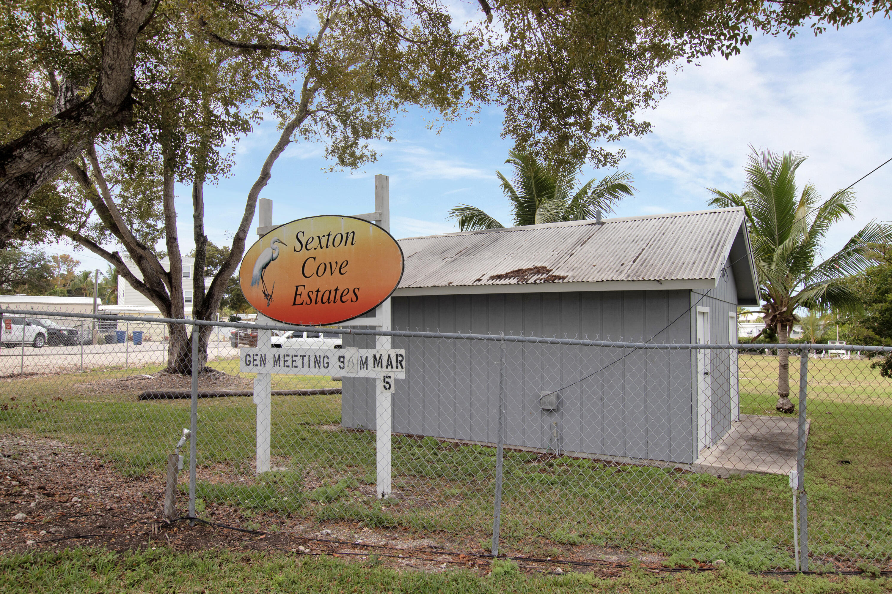13 Flamingo Road Key Largo, FL 33037 - Photo 56 of 63 a backyard of a house with table and chairs