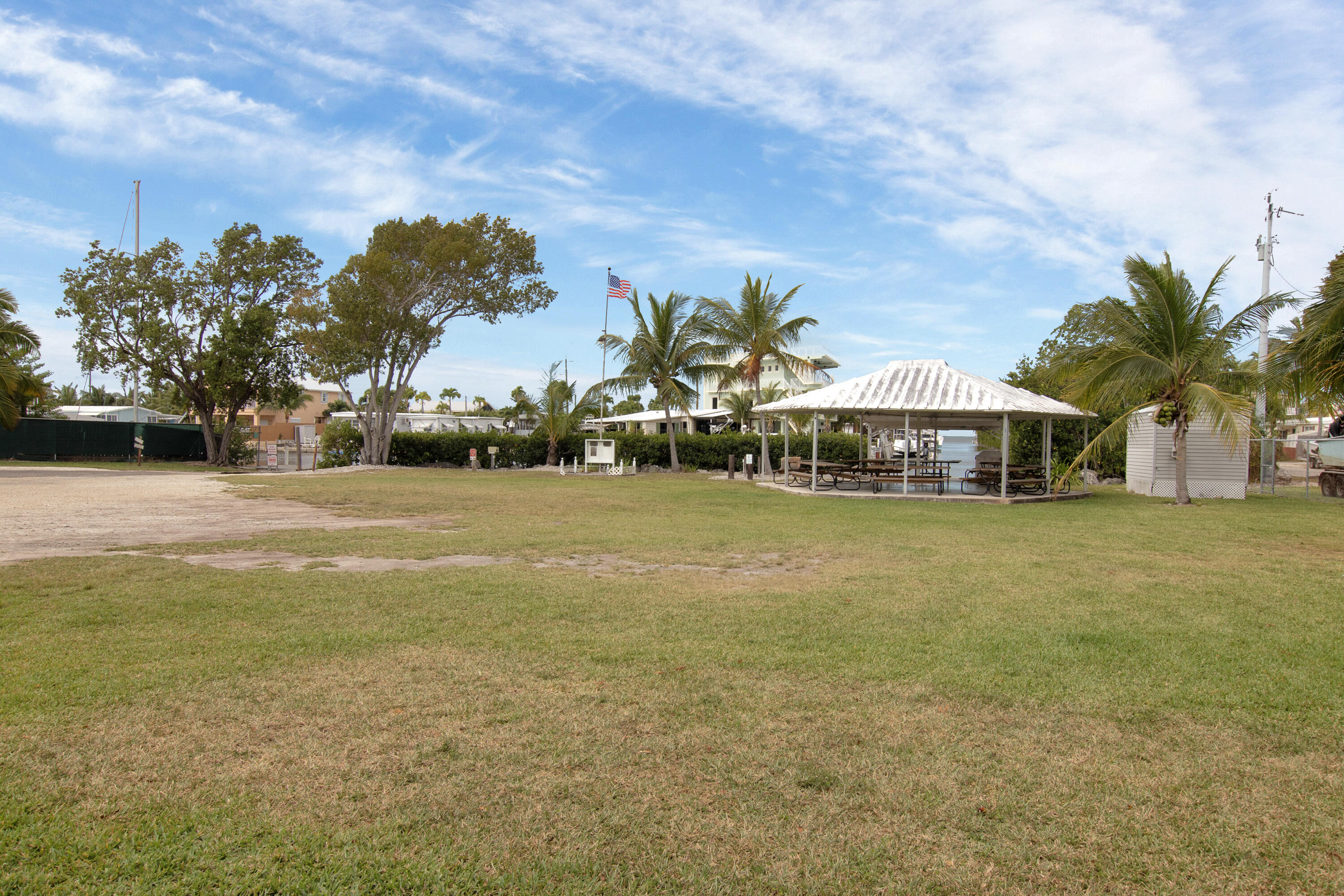 13 Flamingo Road Key Largo, FL 33037 - Photo 62 of 63 a front view of a house with a yard and swimming pool