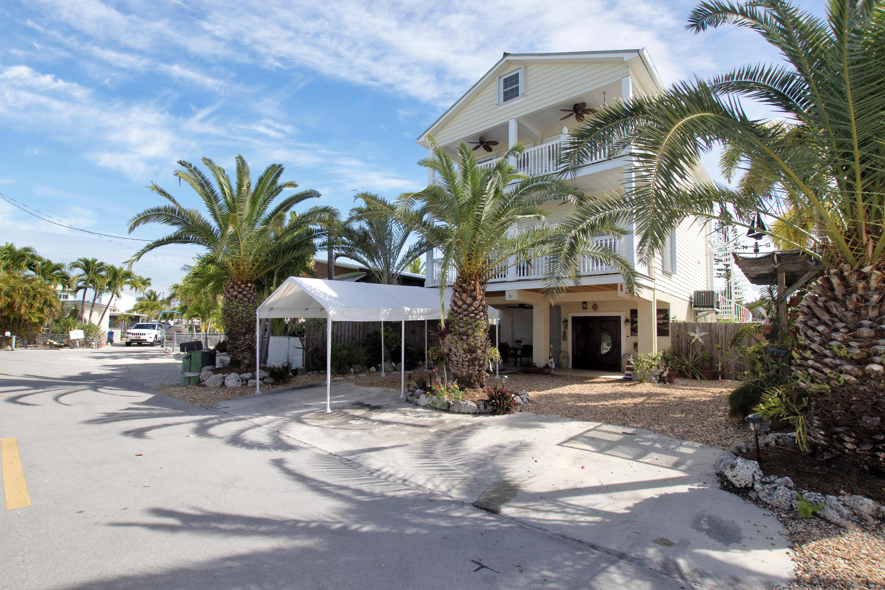 13 Flamingo Road Key Largo, FL 33037 - Photo 10 of 63 a view of a chairs and tables in the patio