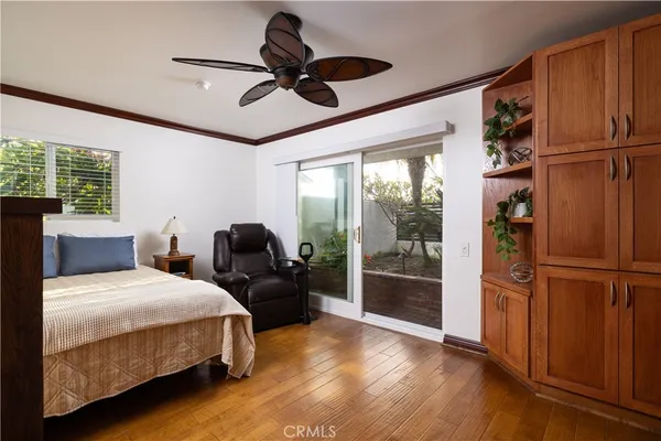 a kitchen with stainless steel appliances kitchen island granite countertop a refrigerator and microwave