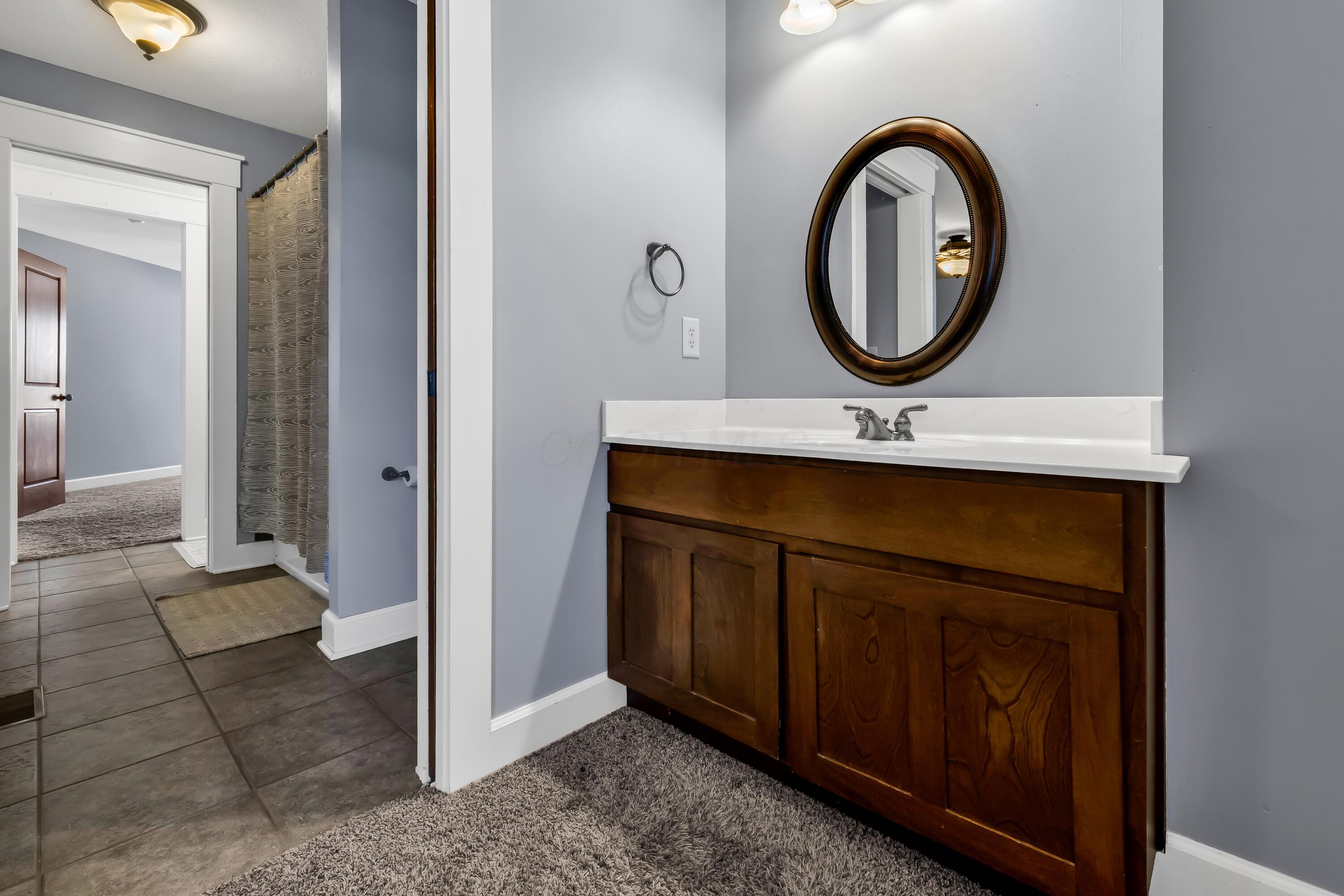 16689 Bailor Road Laurelville, OH 43135 - Photo 35 of 73 • Light sand carpet
• Grey painted walls
• Enclosed vanity with
single bowl, cultured
marble sinktop
• 3 bulb wall light
