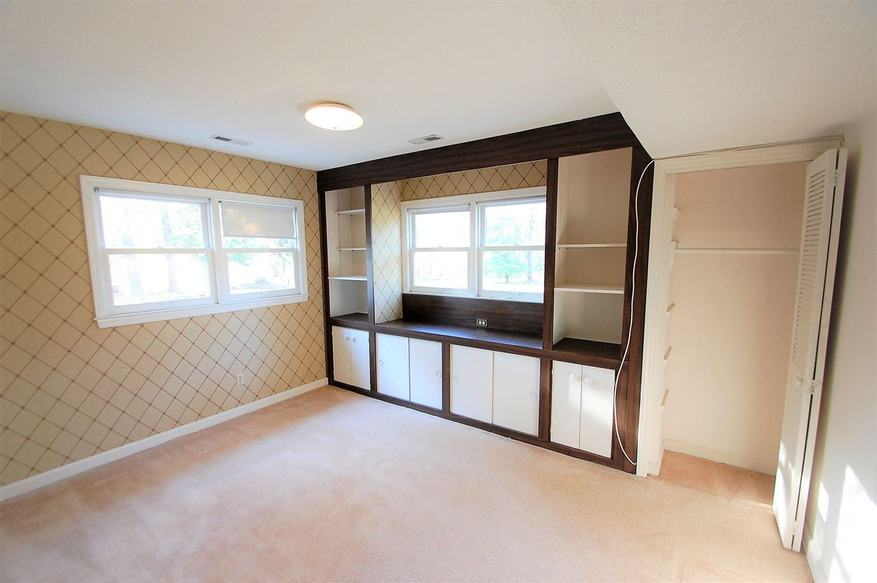 3004 Barnsley Lane Raleigh, NC 27604 - Photo 20 of 25 One of five bedrooms, this bedroom offers ample space with built in storage. Bedroom