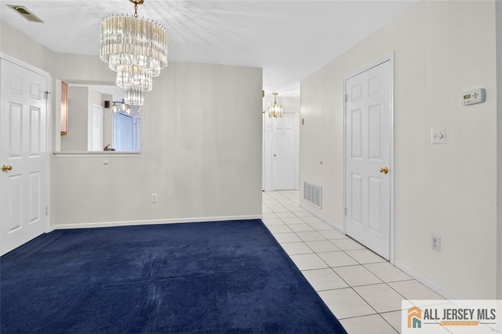 40C Rutland Lane, Unit 40B Monroe Township, NJ 08831 - Photo 8 of 37 a view of entryway with chandelier