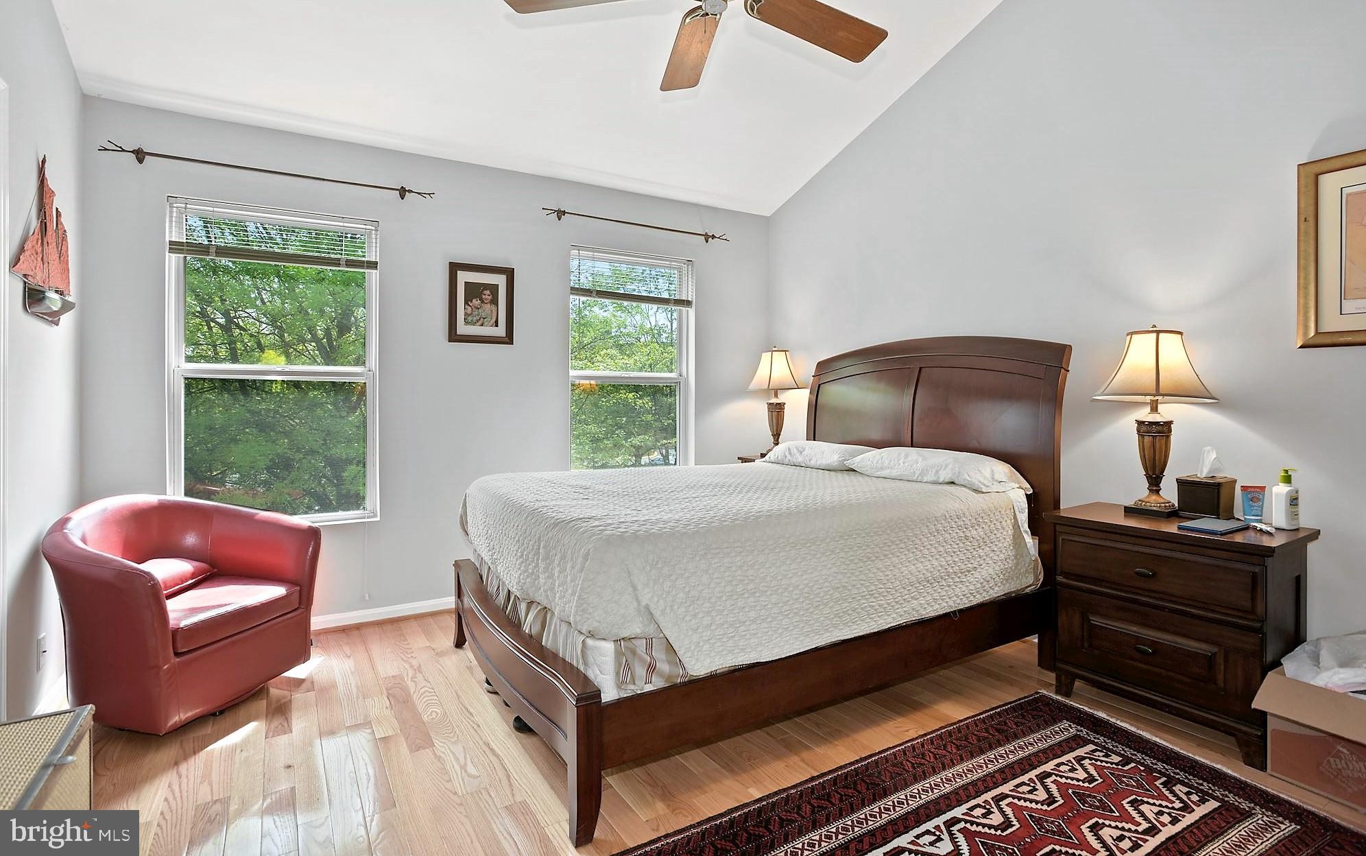 12062 Edgemere Circle Reston, VA 20190 - Photo 14 of 25 a bedroom with a bed and wooden floor