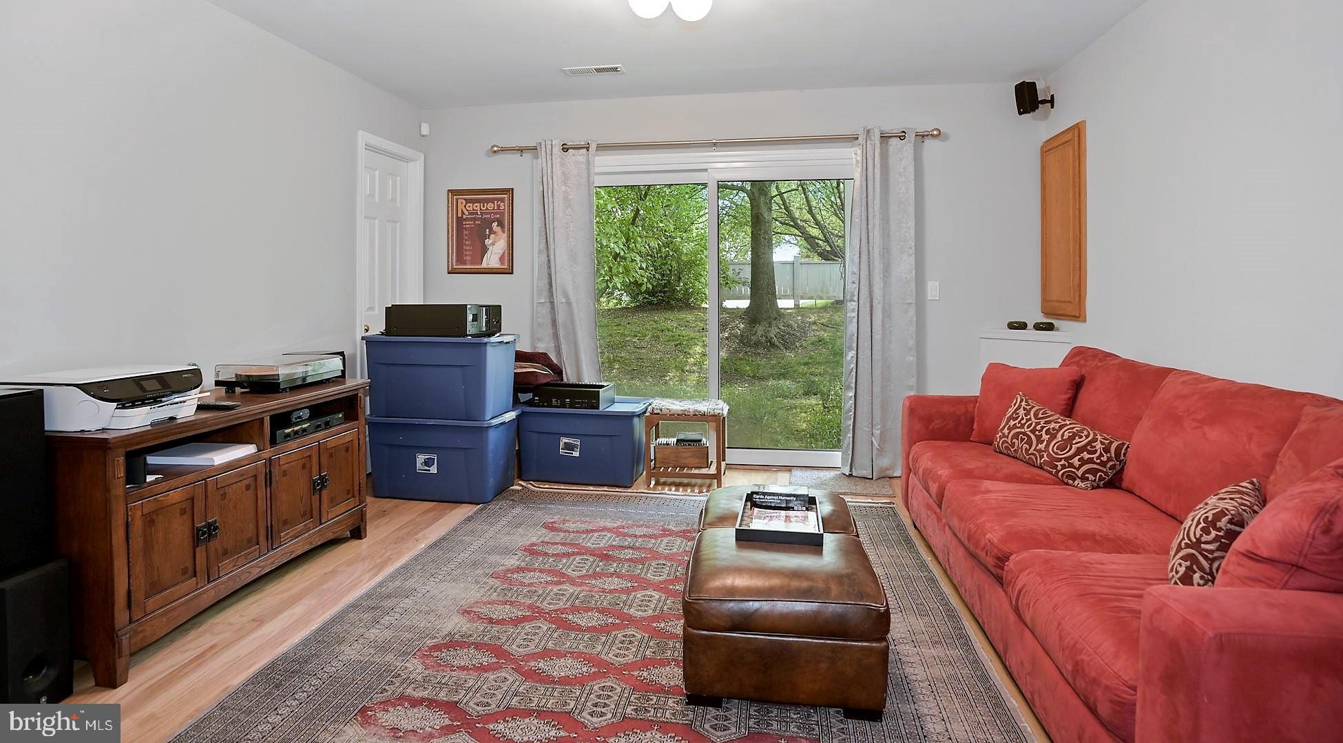 12062 Edgemere Circle Reston, VA 20190 - Photo 3 of 25 a living room with furniture and a fireplace