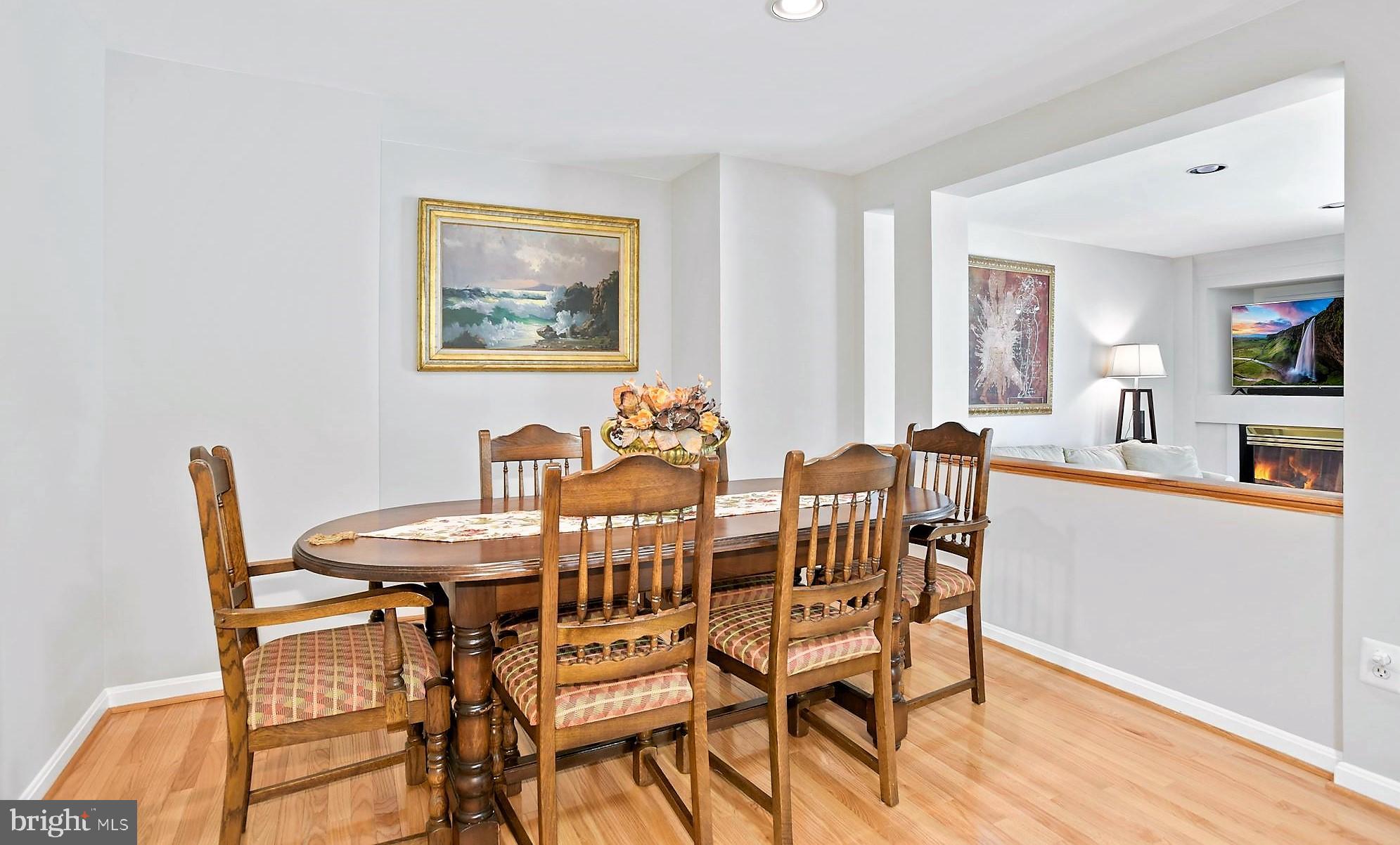 12062 Edgemere Circle Reston, VA 20190 - Photo 8 of 25 a view of a dining room with furniture and wooden floor
