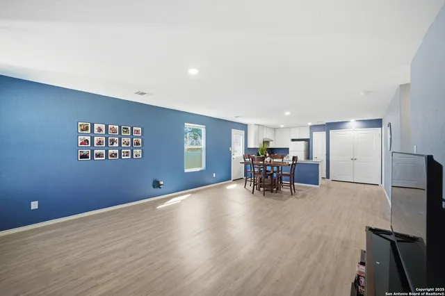 a view of a livingroom with furniture and wooden floor
