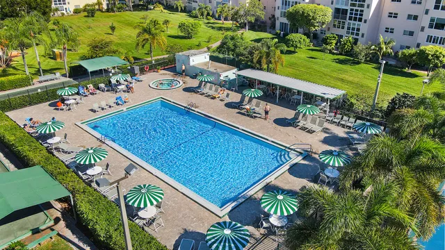 a view of yard from deck with patio