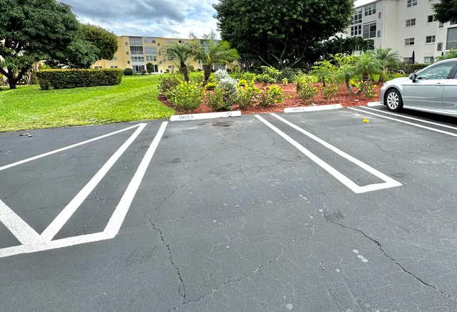 a view of a street with a car parked in front of it