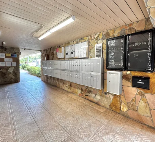 a lobby with furniture and potted plant