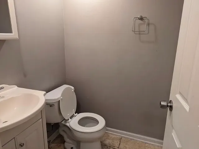a bathroom with a sink and a shower curtain