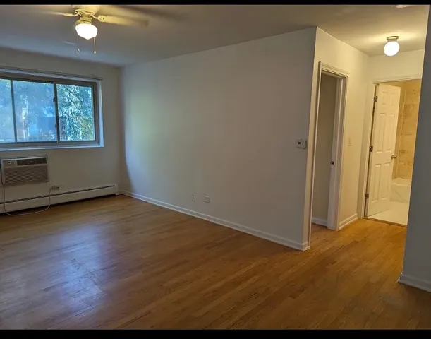 a view of a kitchen with wooden floor