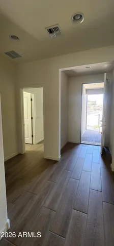 a view of a room that has a grey walls