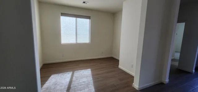 a bathroom with a bathtub sink vanity mirror and toilet