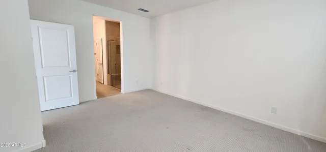 a spacious bathroom with a sink and a mirror
