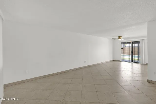 a view of an empty room with glass door