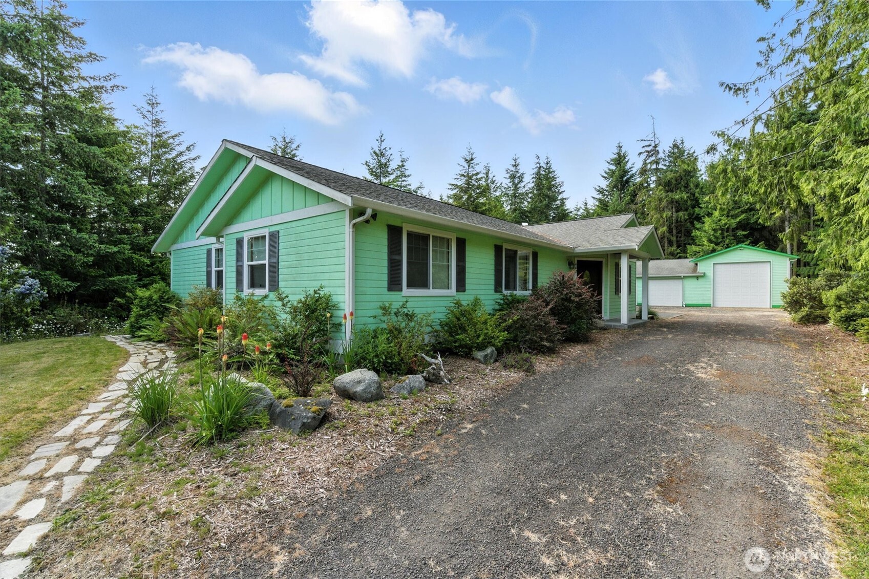 a front view of a house with garden