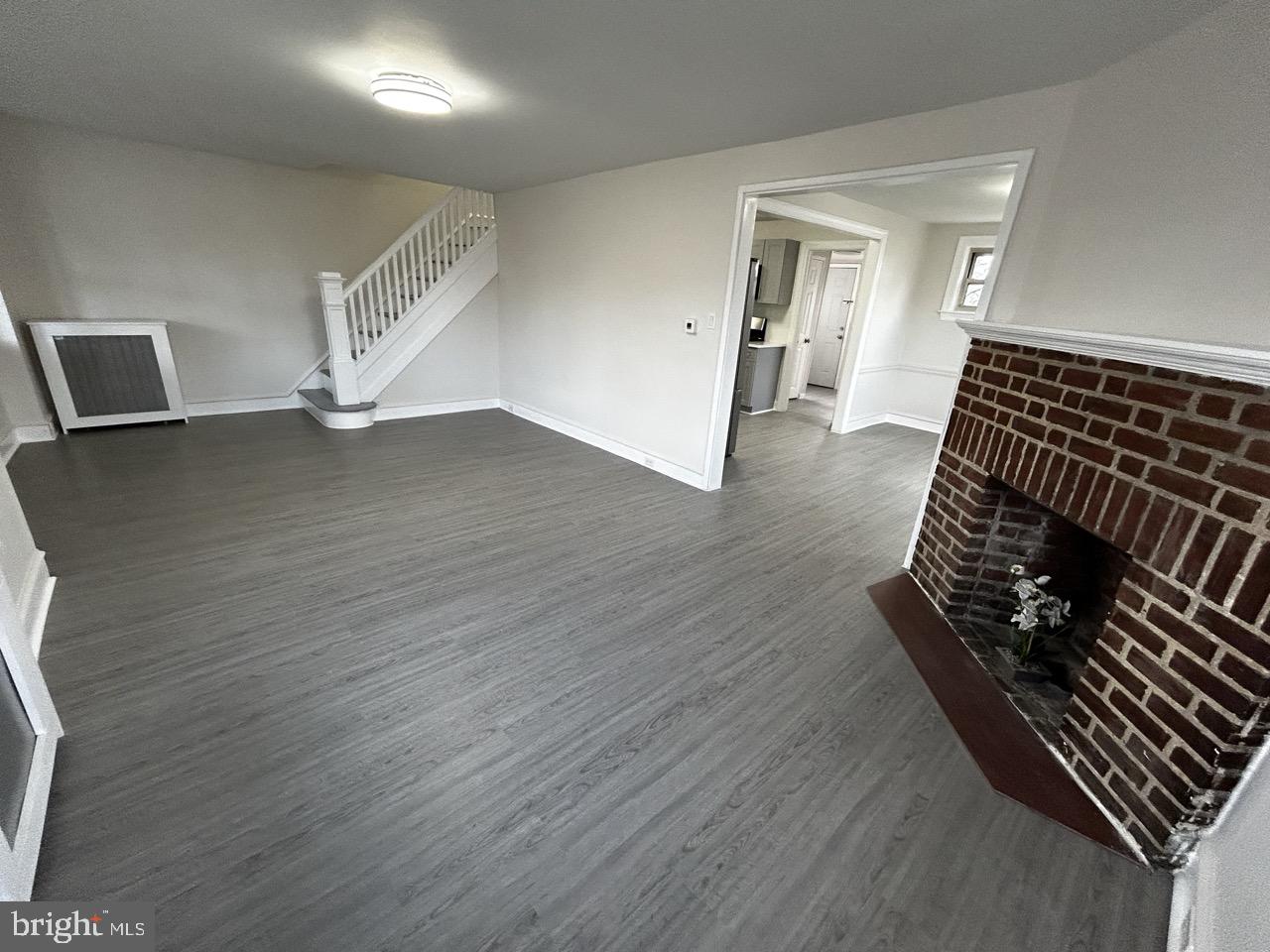6388 Martins Mill Road Philadelphia, PA 19111 - Photo 4 of 15 a view of an empty room with wooden floor and a window