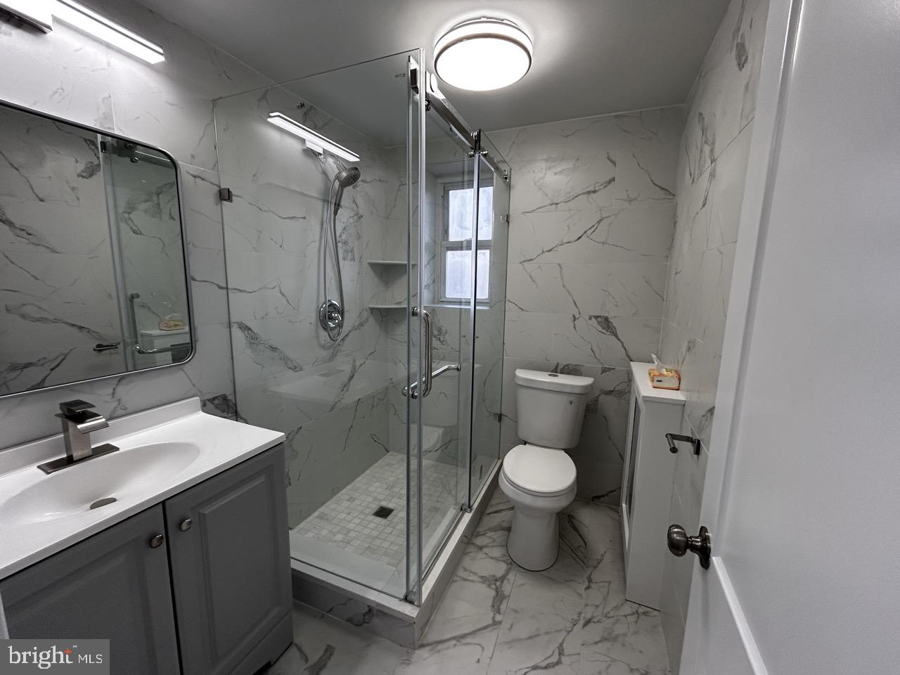6388 Martins Mill Road Philadelphia, PA 19111 - Photo 7 of 15 a bathroom with a sink toilet and shower