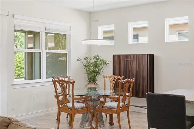 a dining room with furniture and window
