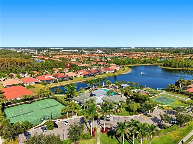 an aerial view of a houses with a lake view