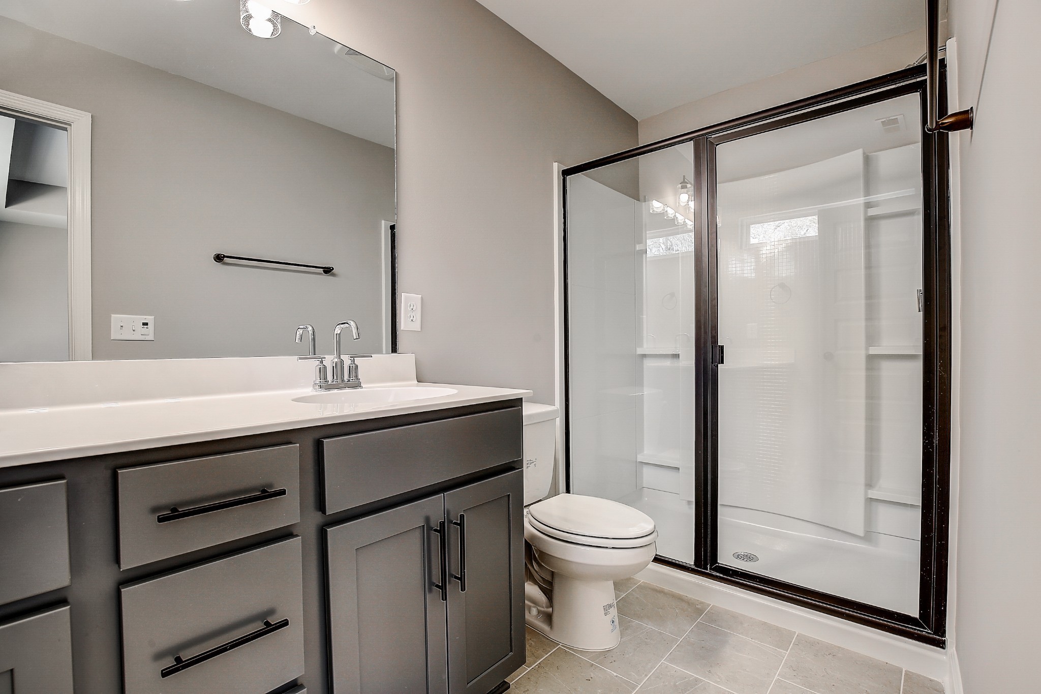 1766 Fenway Loop Antioch, TN 37013 - Photo 29 of 39 a bathroom with a sink mirror toilet and shower