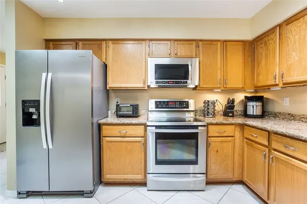 a kitchen with a stove microwave and refrigerator