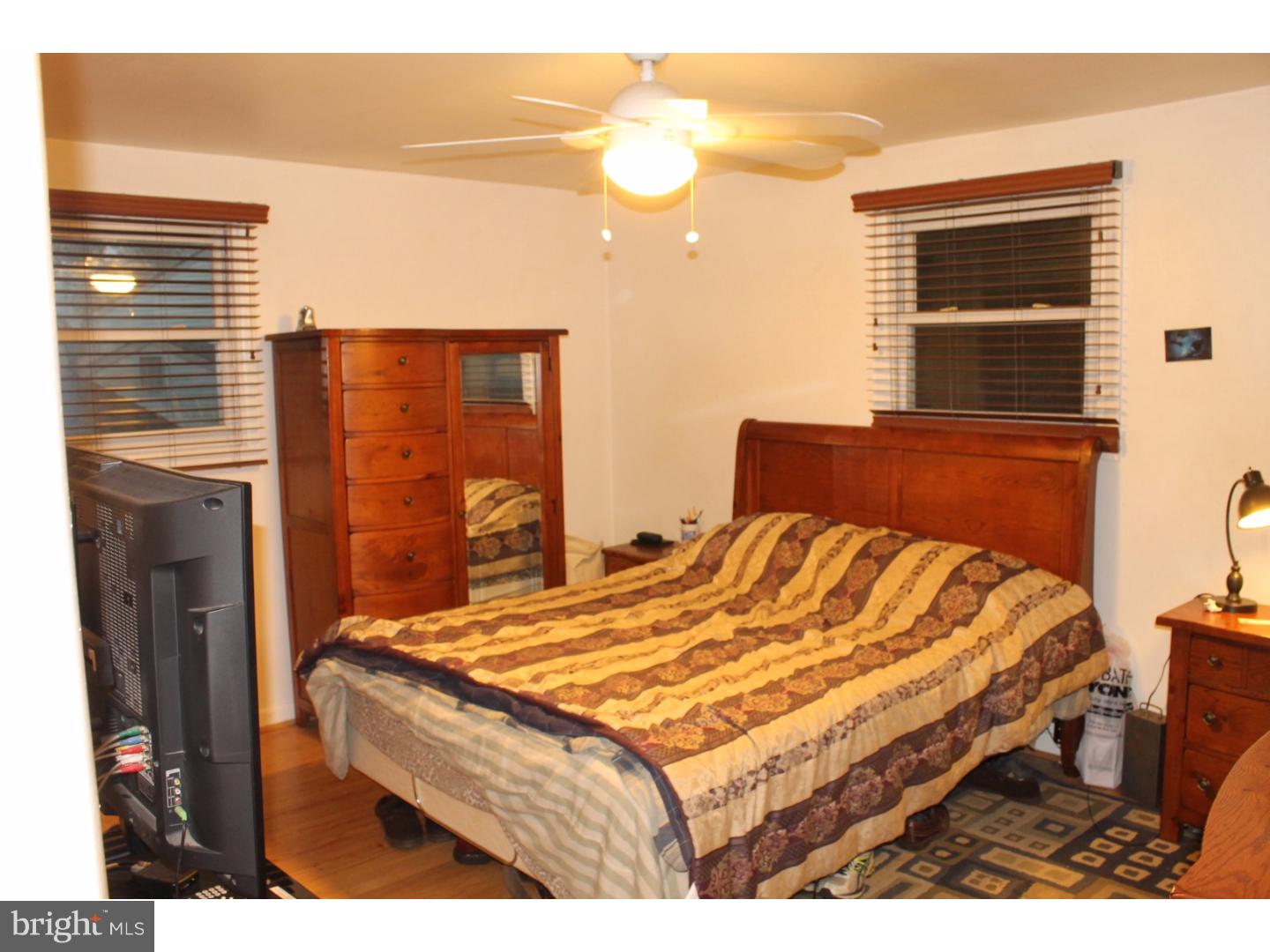 44 Hillside Road Stratford, NJ 08084 - Photo 17 of 25 a bedroom with a bed and a window