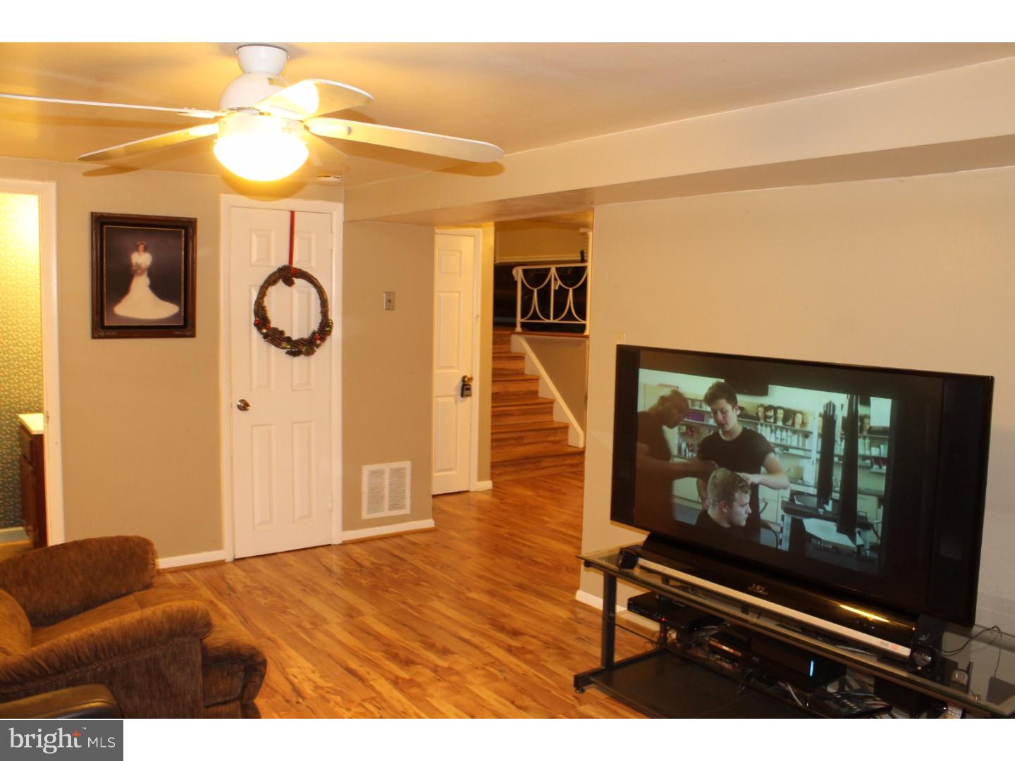 44 Hillside Road Stratford, NJ 08084 - Photo 4 of 25 a living room with furniture and a flat screen tv