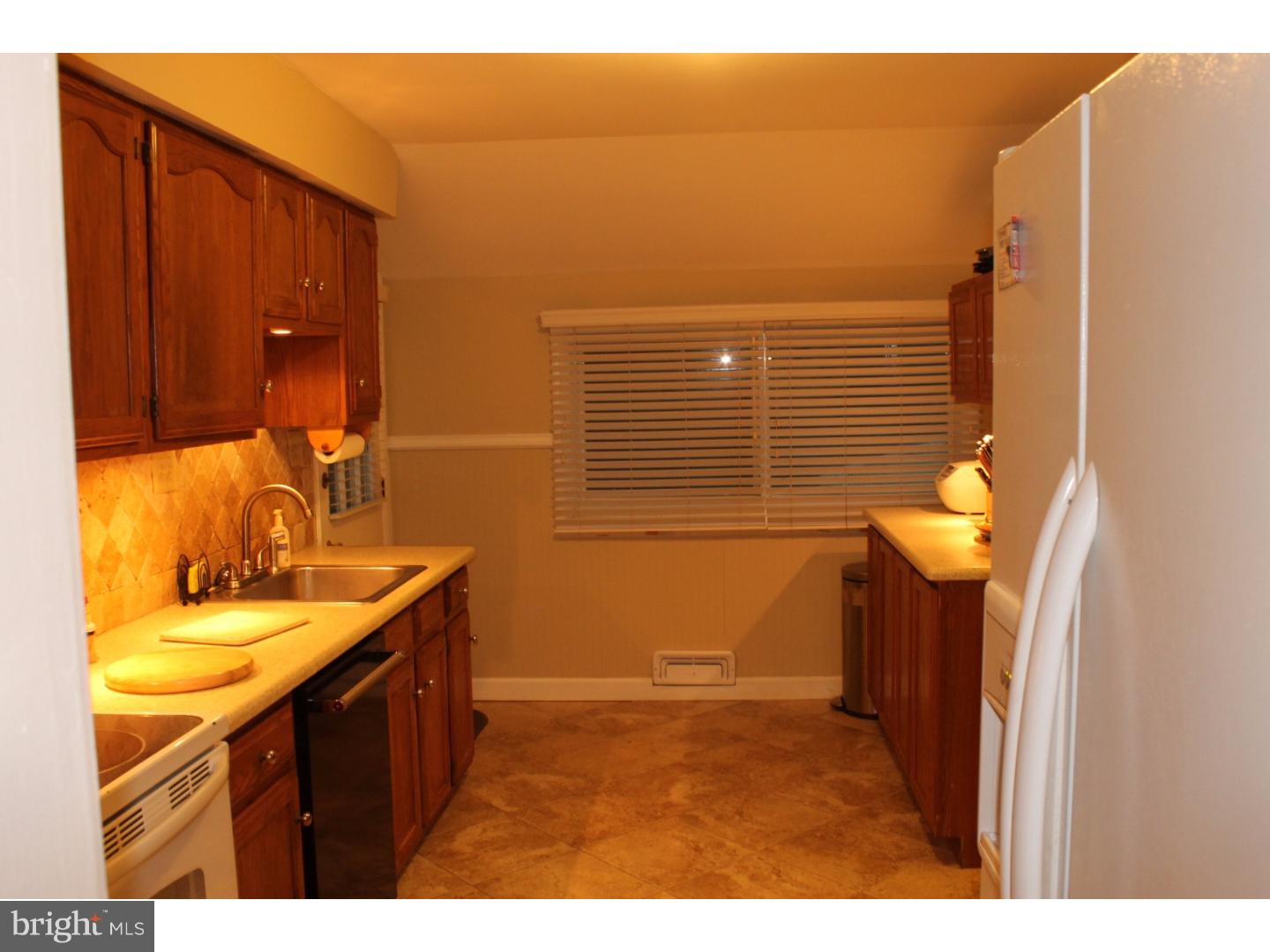 44 Hillside Road Stratford, NJ 08084 - Photo 8 of 25 a bathroom with a sink and a mirror