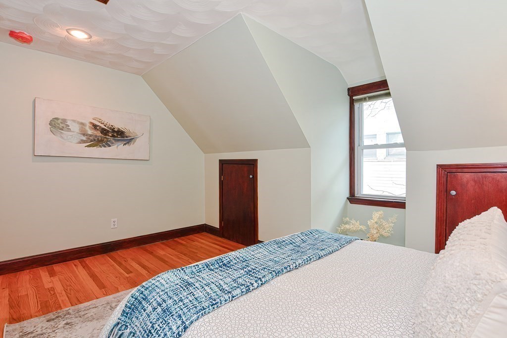 64 Hyde Park Avenue, Unit 3 Boston, MA 02130 - Photo 16 of 27 a bedroom with bed and a window