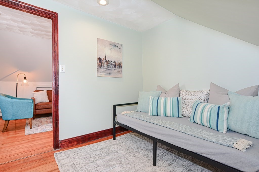 64 Hyde Park Avenue, Unit 3 Boston, MA 02130 - Photo 20 of 27 a living room with furniture and wooden floor