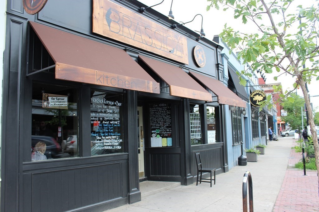 64 Hyde Park Avenue, Unit 3 Boston, MA 02130 - Photo 26 of 27 a view of street with shops