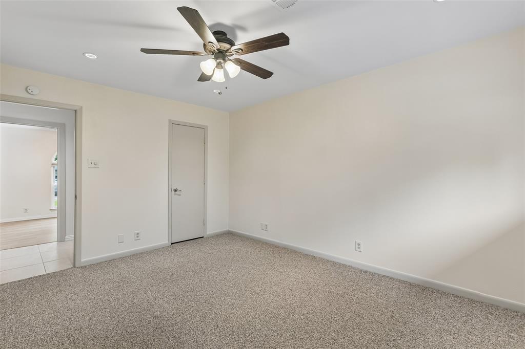 1548 Timbercreek Drive Howe, TX 75459 - Photo 19 of 24 an empty room with a ceiling fan and a window