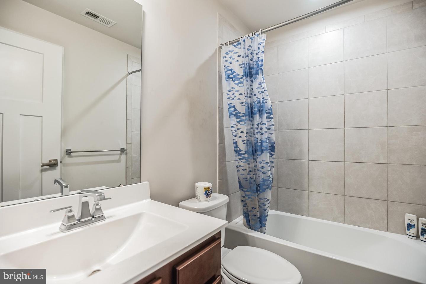 28 Sparrow Circle Sewell, NJ 08080 - Photo 14 of 15 a bathroom with a sink toilet a mirror and shower