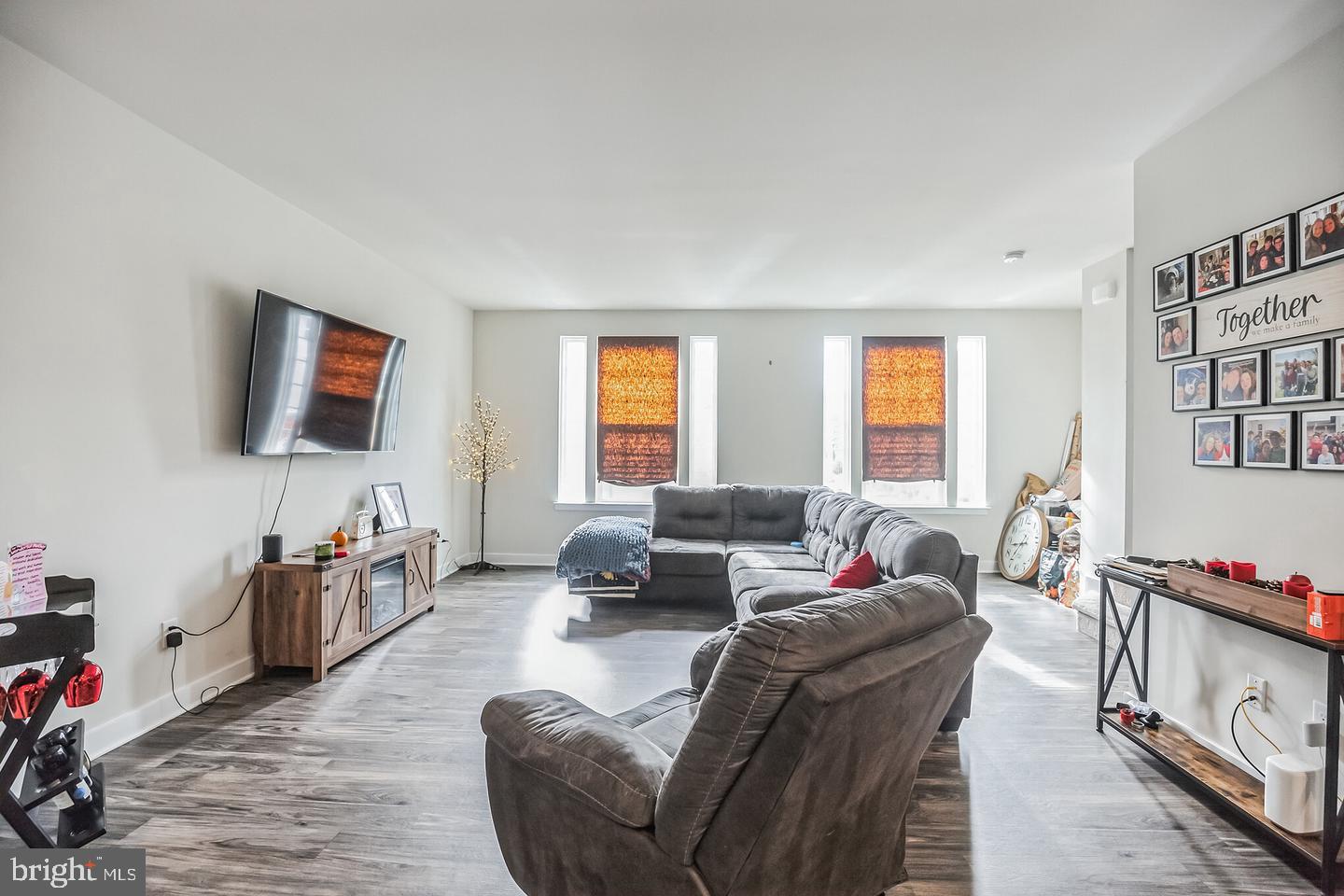 28 Sparrow Circle Sewell, NJ 08080 - Photo 7 of 15 a living room with furniture a flat screen tv and a window