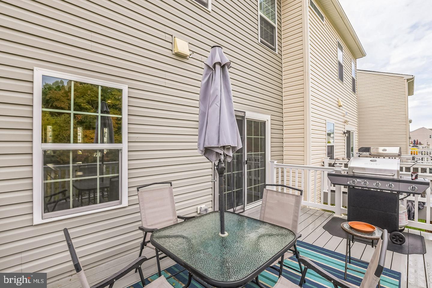 28 Sparrow Circle Sewell, NJ 08080 - Photo 9 of 15 a patio with table and chairs and potted plants
