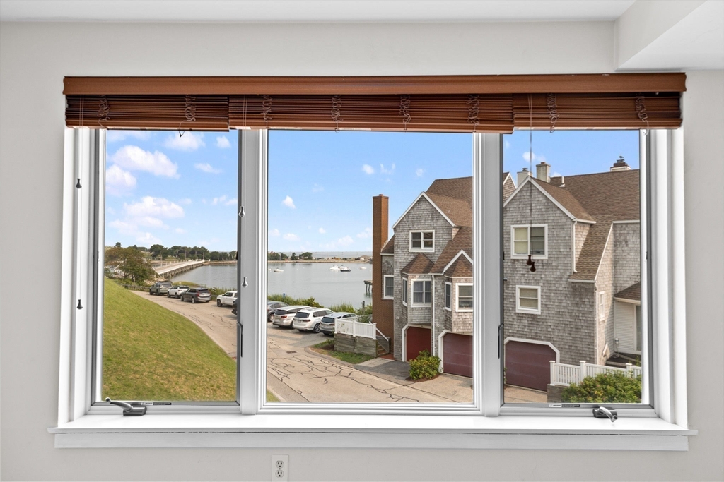1 Commodore Court, Unit 305 Hull, MA 02045 - Photo 13 of 27 a view of a living room window
