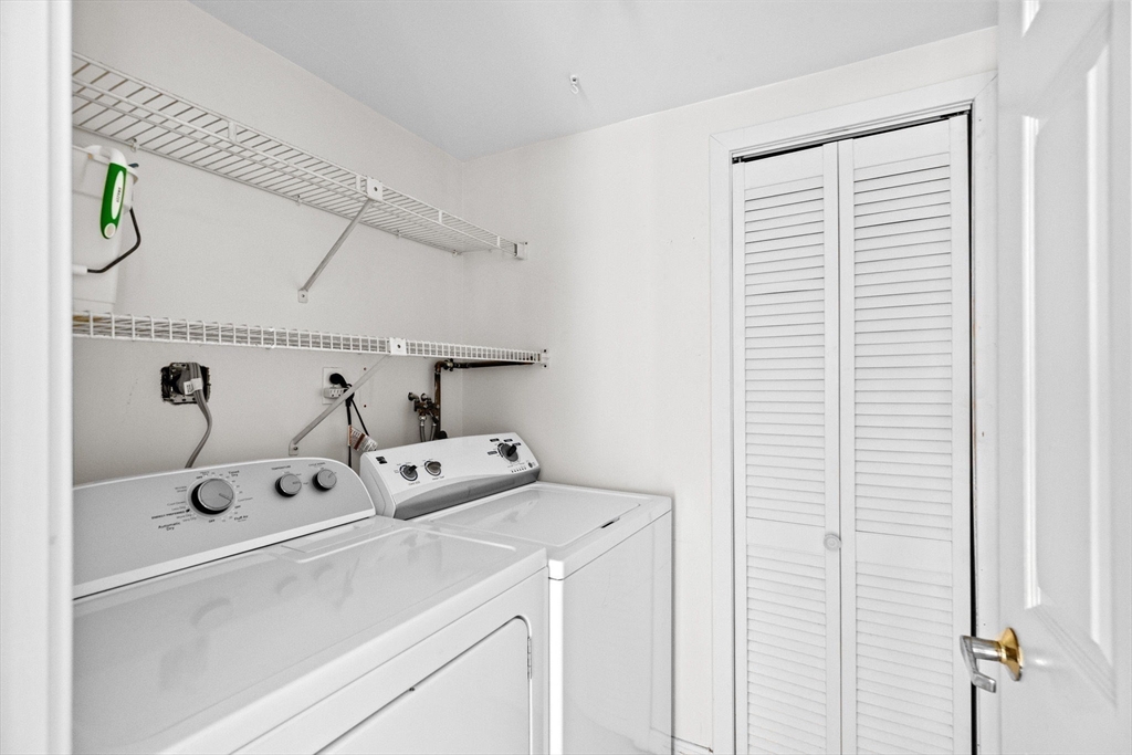 1 Commodore Court, Unit 305 Hull, MA 02045 - Photo 19 of 27 a utility room with dryer and washer