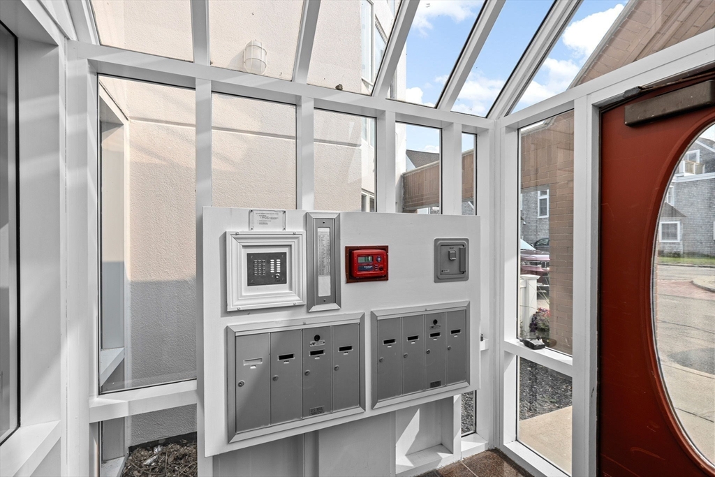 1 Commodore Court, Unit 305 Hull, MA 02045 - Photo 22 of 27 view of living room with furniture and flat screen tv