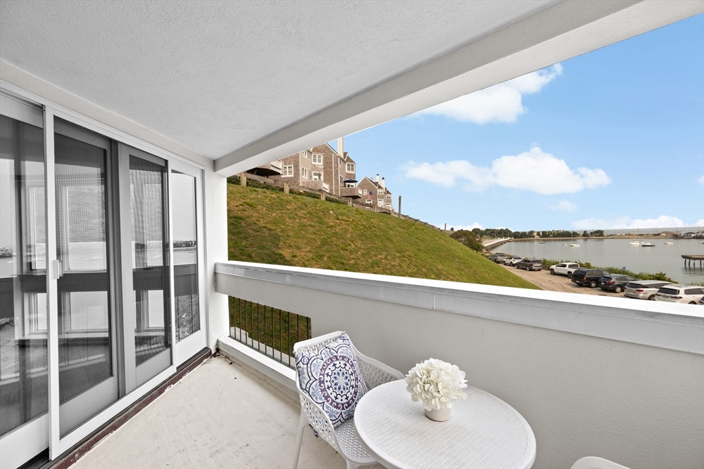 1 Commodore Court, Unit 305 Hull, MA 02045 - Photo 5 of 27 a bathroom with a sink and a mirror