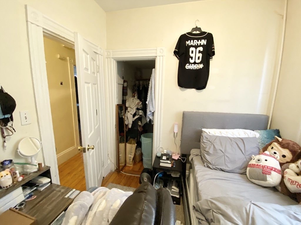 72 Calumet Street, Unit 1 Boston, MA 02120 - Photo 7 of 8 a bedroom with a bed and wooden floor